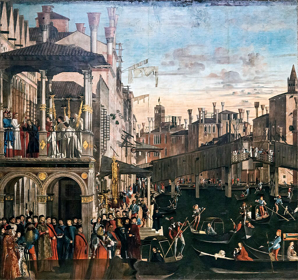 Painting depicting the crowded streets and canals of Venice. On a balcony, men in white robes kneel as a man is blessed by a priest.