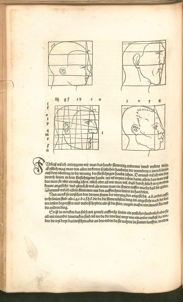 Book open to a page with sketches of male profiles. Each face has a grid drawn over it.