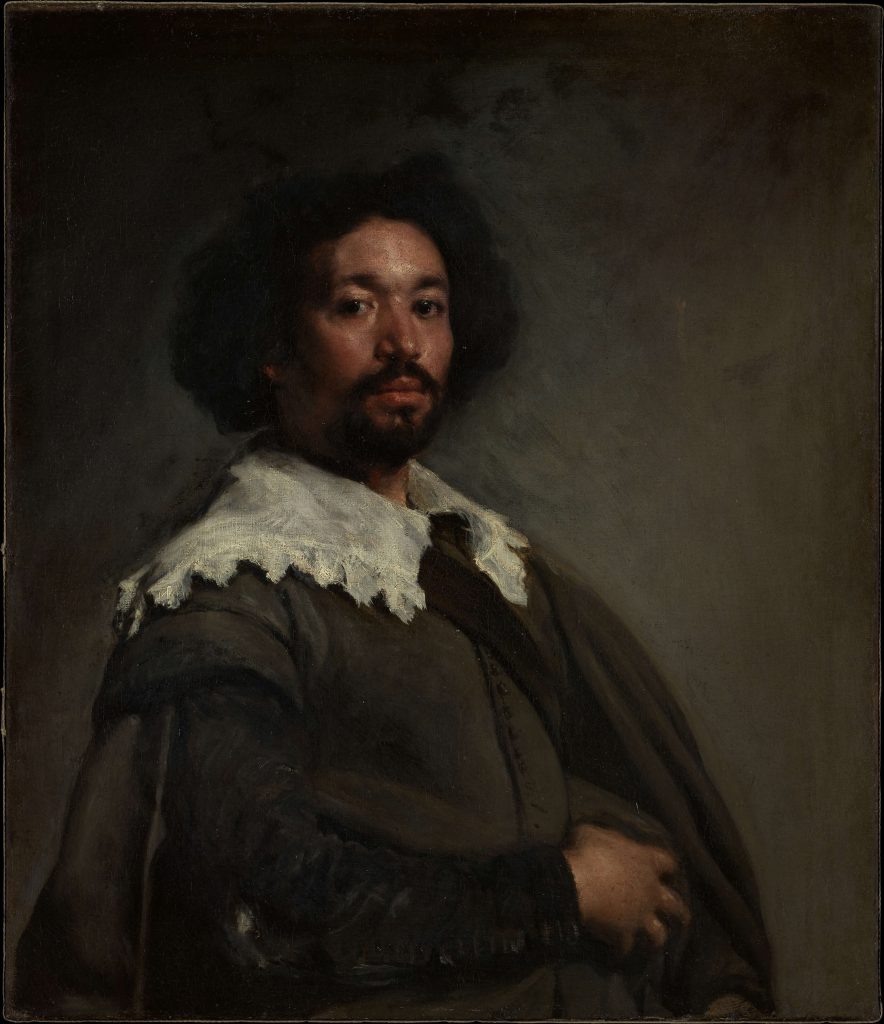 Oil portrait of Diego Velázquez. He wears a lace collar and a green cloak.