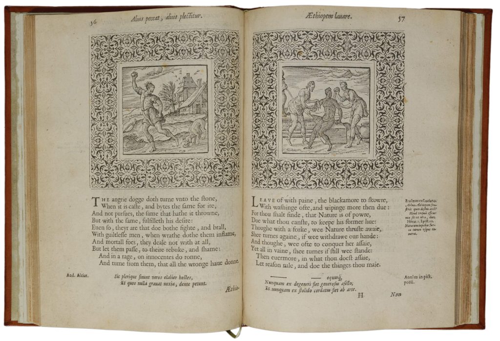 An emblem book open to a woodcut of a Black man being forcibly washed by two white men.