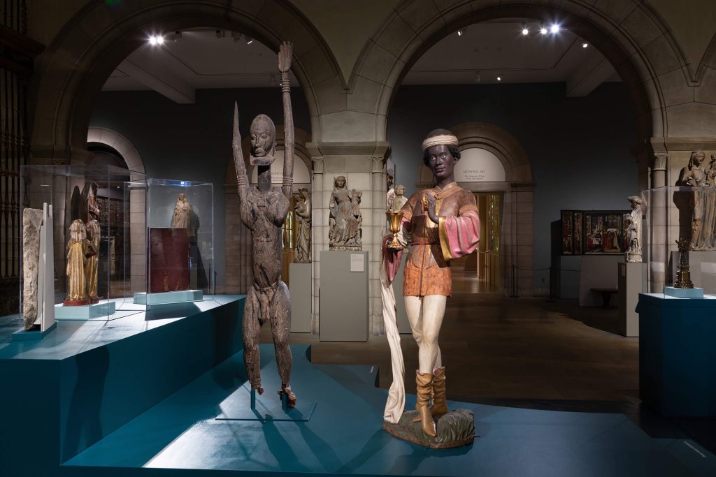 Sculpture of an African Magus surrounded by other works of African art for the Met's 2020 Crossroad's installation.